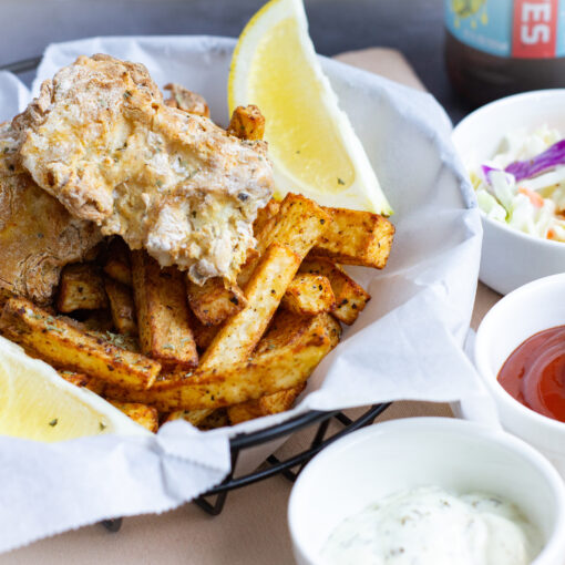 Air Fryer Beer Battered Fish & Chips served with ketchup, tartar sauce, and coleslaw