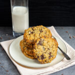 Oatmeal Raisin Chocolate Chip Cookies with a cup of milk