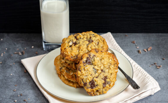 Oatmeal Raisin Chocolate Chip Cookies with a cup of milk